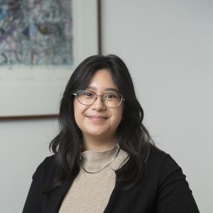 Woman sitting at a table smiling