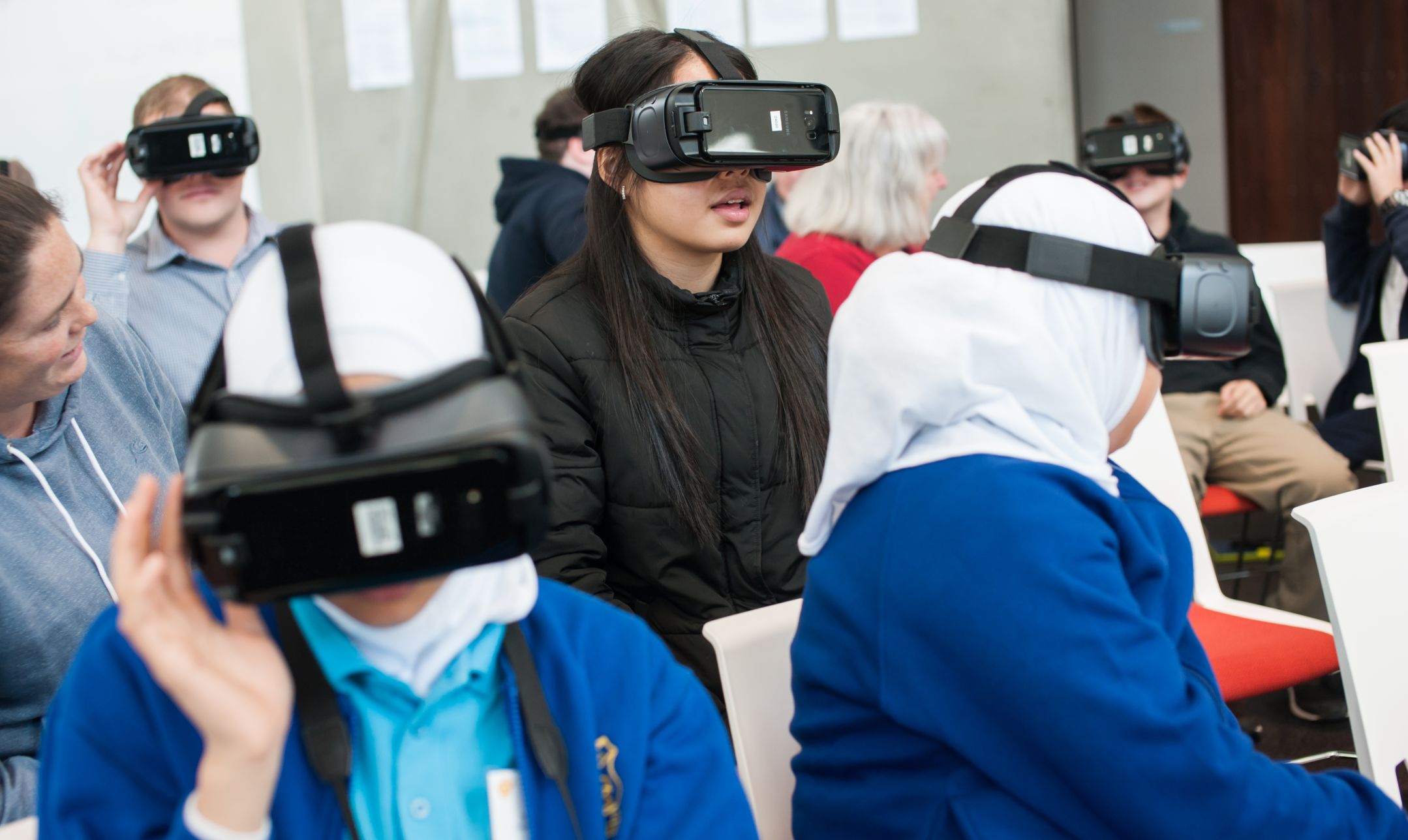 Students wearing VR goggles