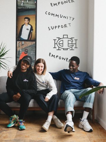 3 young people sitting on a couch
