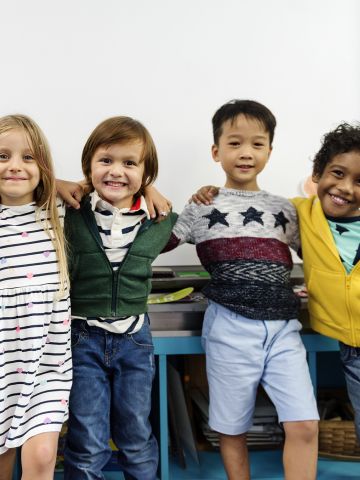 Five young children smiling