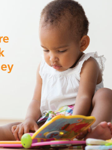Image of toddler looking at a book with text saying: Right now almost 23% of Australia's children are not developmentally on-track with language skills when they start school.
