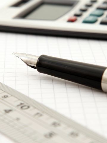 Ruler, fountain pen and calculator