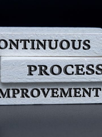 3 stacks blocks with the words: continous, process, improvement stamped on them